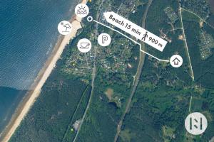an island with a street sign and some icons at Rabarberi LV just 15min walk to SeaSide in Saulkrasti