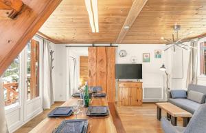 a living room with a table and a couch at Chalet de Seyne in Seyne