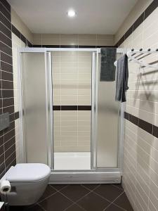 a bathroom with a shower and a toilet at Nur Sena's House in Istanbul +39 photos