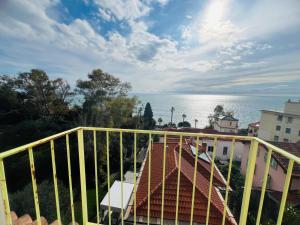 a balcony with a view of the water at Suite La Brezza - Luxury Sanremo in Sanremo