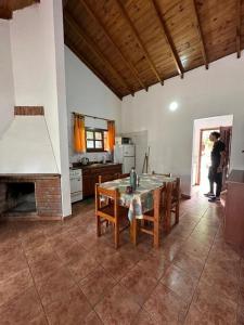 a person standing in a kitchen with a table at OKIN 25 New in Costa del Este