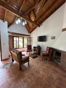 a living room with a couch and a fireplace at OKIN 25 New in Costa del Este
