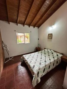 a bedroom with a bed in a room with a window at OKIN 25 New in Costa del Este