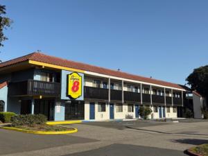 an empty parking lot in front of a hotel at Super 8 by Wyndham Petaluma in Petaluma +24 photos