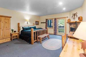 a bedroom with a bed and a fireplace at Daniels Summit Lodge in Wallsburg +43 photos