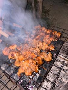 a bunch of food cooking on a grill at Sameer Homestay in Kalimpong +34 photos