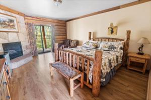 a bedroom with a bed and a fireplace at Daniels Summit Lodge in Wallsburg