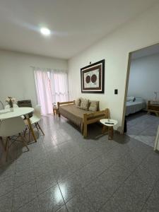 a living room with a couch and a table at Santa Genoveva in Neuquén