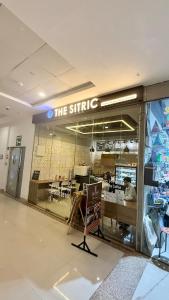 a store front with a sign that reads the stir shop at Sundowner Hive115 Jacuzzi studio Large grdan patio in Gurgaon +56 photos