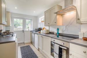 a kitchen with white cabinets and a sink at 2 Bed in Brough oc-c31900 in Brough +15 photos