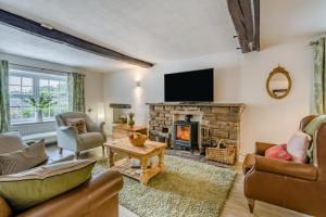 a living room with a fireplace and a flat screen tv at 2 Bed in Brough oc-c31900 in Brough