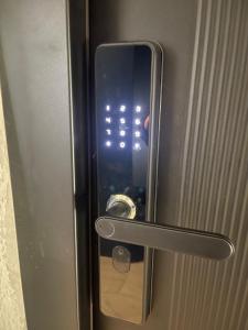 a glass door with a door knob on a door with a door at E - Central Room Five in Skopje