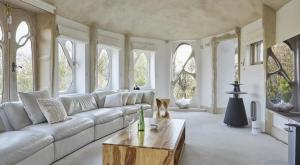 a living room with a couch and a coffee table at Glastonbury tranquility in Glastonbury