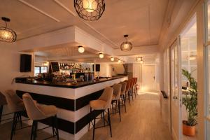 a bar in a restaurant with stools at Zodia Craiului in Peştera