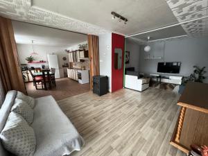 a living room with a couch and a table at Apartmán Renata in Rudník