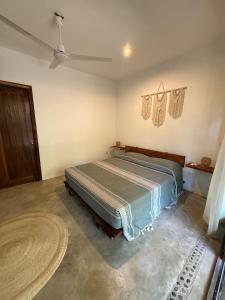 a bedroom with a bed in a room at Green oasis across from the main street in Mazunte