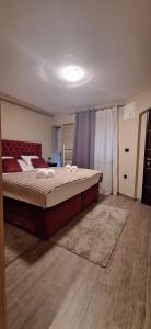 a bedroom with a large bed in a room at Tkalča Room 22 in Zagreb +18 photos