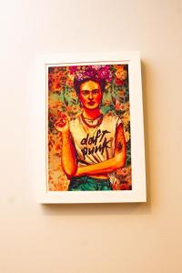 a picture of a painting of a man on a wall at Book Santos Mar à Vista no Unique Residence 1810 in Santos