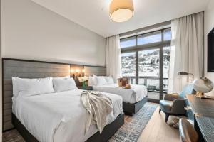 a hotel room with two beds and a window at Abode at Deer Valley East in Park City +52 photos
