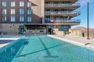 a large swimming pool in front of a building at Abode at Deer Valley East in Park City
