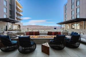 a patio with chairs and a couch and a fire pit at Abode at Deer Valley East in Park City
