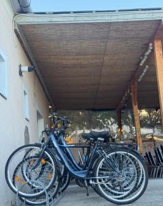 a group of bikes parked under a building at Èlmèny Vendègház in Csurgó