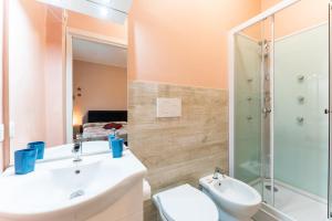 a bathroom with a sink and a shower and a toilet at tra il borgo e il mare in Cervo