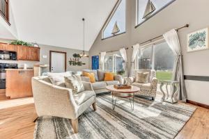 a living room with a couch and chairs and a table at Bridges Bay Vacation Cabin 126 in Arnolds Park