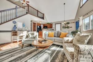 a living room with a couch and a table at Bridges Bay Vacation Cabin 126 in Arnolds Park