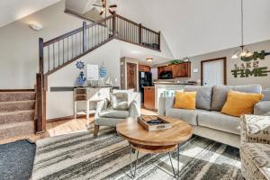 a living room with a couch and a table at Bridges Bay Vacation Cabin 126 in Arnolds Park