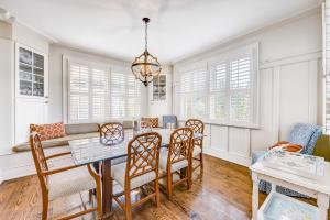 a dining room with a table and chairs at Beach cottage with private pool & spa, ocean views, & shared pool access in Saint Simons Island