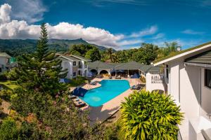 an aerial view of a house with a swimming pool at Sun Properties and Resort Hotel in Beau Vallon