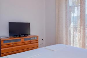 Televízia a/alebo spoločenská miestnosť v ubytovaní MI Apartment