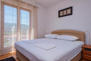 Posteľ alebo postele v izbe v ubytovaní MI Apartment