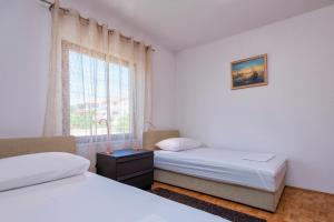 Posteľ alebo postele v izbe v ubytovaní MI Apartment