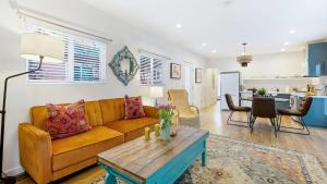 a living room with a couch and a table at Urban Jungle by AvantStay in Los Angeles +19 photos
