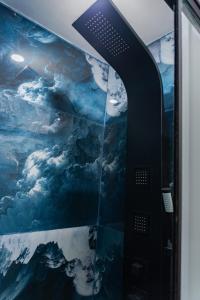 a ceiling in an airplane with a painting of clouds at Apartment E18 UPAO 2nd Floor in Trujillo +14 photos