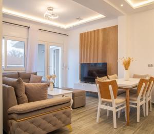 a living room with a couch and a table at Villa Voka in Acharavi