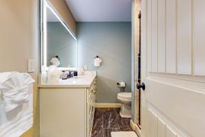 a bathroom with a sink and a toilet at Work, Play & Stay! Apt Near Holyoke Medical Center in Holyoke +14 photos