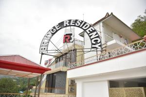 a sign for a restaurant on the side of a building at River View Hotel in Heart of Muzaffarabad,213 in Muzaffarabad +16 photos