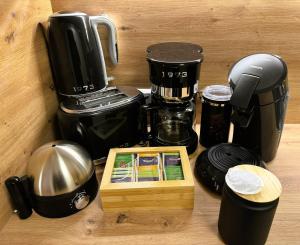 a counter with a coffeemaker and a coffee maker at Ferienwohnung Waldrose am Titisee in Titisee +21 photos