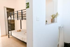 a bedroom with a bunk bed in a room at Il-Qastna Holiday House in Żejtun +33 photos