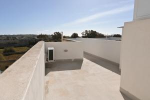 a view from the balcony of a house at Il-Qastna Holiday House in Żejtun