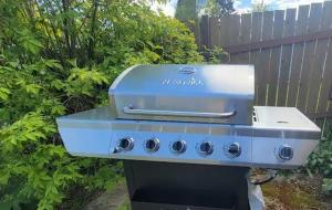 a grill sitting on top of a stove at Close to everything in Tacoma! in Tacoma