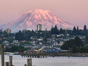 a mountain in the distance with a town and a city at Close to everything in Tacoma! in Tacoma