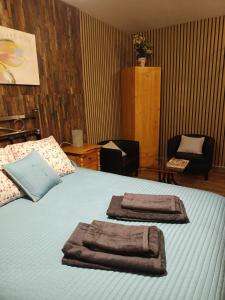 a bedroom with a bed with towels on it at Apartamento Turístico Monteceli AT-CC-00748 in Gata +22 photos