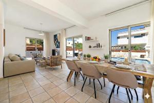 a large dining room with a table and chairs at Fig Tree Beach Villa One in Protaras