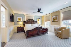 a bedroom with a bed and a chair at Steps to Holyoke Medical Center! Remote-Work Hub in Holyoke