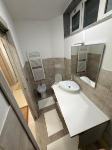 a bathroom with a sink and a toilet at Villa Mare & Monti in Genoa +48 photos