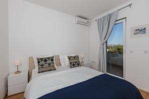 Postel nebo postele na pokoji v ubytování Villa Casabianca + 37 fotografií